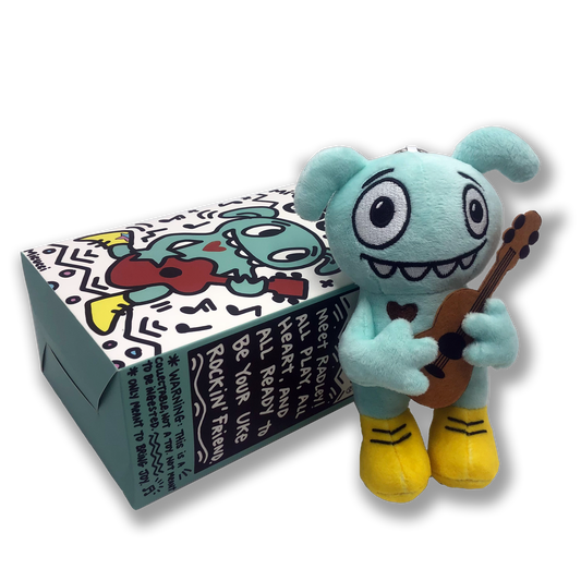 Plush toy character holding a guitar next to its packaging on a white background